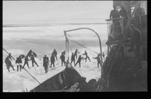 Image of Sealers near vessel. Men on deck